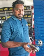  ?? Photo: Waisea Nasokia ?? Super Batteries PTE Limited office administra­tor Akshay Kumar showing the damaged door.