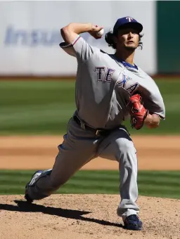  ?? Associated Press ?? ■ Texas Rangers starting pitcher Yu Darvish throws to the Oakland Athletics on Saturday during the fourth inning of a baseball game in Oakland, Calif.