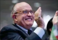  ?? ANDREW HARNIK — THE ASSOCIATED PRESS ?? Rudy Giuliani, an attorney for President Donald Trump, applauds at the Iran Freedom Convention for Human Rights and democracy at the Grand Hyatt, Saturday in Washington.