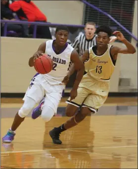  ?? Terrance Armstard/News-Times ?? On the move: El Dorado's Joderrio Ramey drives against Hot Springs' Caleb Campbell. The Trojans downed the Wildcats 71-66 Friday night at Wildcat Arena.