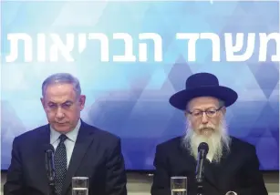  ?? (Marc Israel Sellem/The Jerusalem Post) ?? PRIME MINISTER Benjamin Netanyahu and Health Minister Ya’acov Litzman yesterday at a Health Ministry briefing.