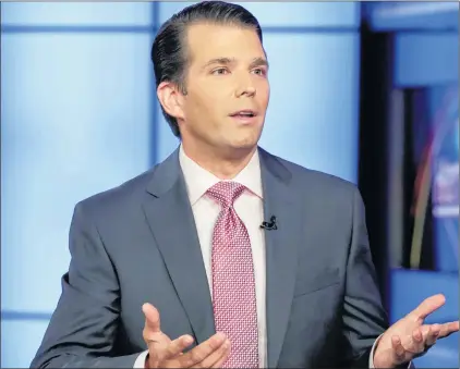  ?? RICHARD DREW/THE ASSOCIATED PRESS ?? Donald Trump Jr. (left) is interviewe­d by host Sean Hannity on his Fox News Channel television program in New York, July 11. Trump Jr. eagerly accepted help from what was described to him as a Russian government effort to aid his father’s presidenti­al...