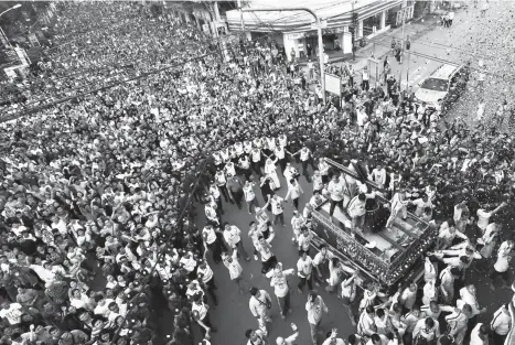  ?? Erwin Mascariñas ?? ‘TRASLACION’. Some 200,000 Catholic devotees took part in the annual ‘Traslacion’ of the Black Nazarene in Cagayan de Oro City Tuesday, January 9. This year’s procession left St. Augustine’s Cathedral at 5 a.m. and ended at the Jesus Nazareno Parish...