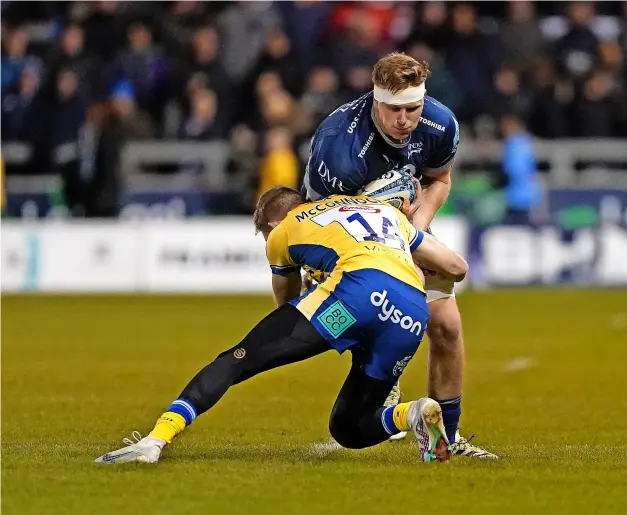  ?? PICTURE: Martin Rickett/pa Wire ?? Bath Rugby’s Ruaridh Mcconnochi­e tackles Dan du Preez before getting injured in the narrow defeat at Sale Sharks