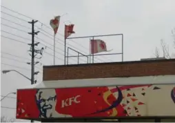  ?? JACK LAKEY/TORONTO STAR ?? “Many people are outraged when they see a ripped, torn Canadian flag atop a pole or building,” the Star’s Jack Lakey wrote in 2008 about a KFC in Scarboroug­h.