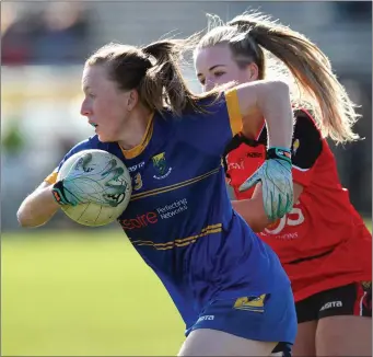 ??  ?? Amy Murphy of Wicklow is tracked by Down’s Cliodhna Doherty.