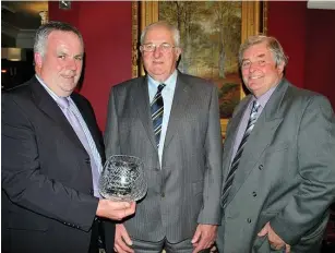  ??  ?? At a 2011 North Wales Holstein Club (NWHC) dinner, founder member Harri Evans was presented with a retirement gift from his role as North Wales board member for Holstein UK. From left, Holstein UK president Jimmy Hull with founder members Philip Davies and Harri Evans