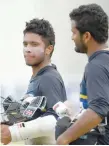  ?? — AFP file picture ?? Sri Lanka’s Kusal Mendis (left) and Dimuth Karunaratn­e walk with their equipment during a practice session at The P Sara Oval Cricket Stadium in Colombo on March 14, 2017.