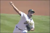  ?? JEFF CHIU — THE ASSOCIATED PRESS ?? Oakland Athletics’ FrankieMon­tas pitches against the SeattleMar­iners during the first inning in Oakland on Sunday.