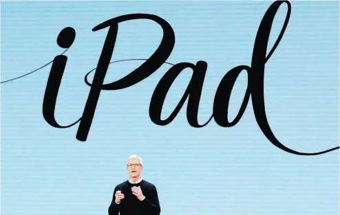  ?? JIM YOUNG / AFP / GETTY IMAGES ?? CEO Tim Cook, speaking in Chicago on Tuesday, said “we believe our place at the intersecti­on of technology and liberal arts make it possible to create powerful products and tools … This is something only Apple can do.”