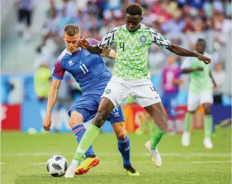  ??  ?? One of the players in camp Nigeria's Wilfred Ndidi (4) and Iceland's Alfred Finnbogaso­n (11) fight for the ball in their 2018 FIFA World Cup Group D match at Volgograd Arena Stadium Photo: