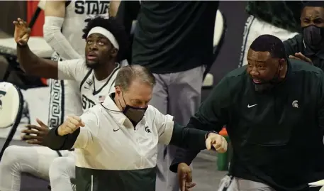  ?? AP ?? IZZOK WITH IT: Michigan State head coach Tom Izzo reacts after a late key three-point basket by guard Joshua Langford against Michigan Sunday.