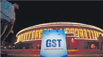  ?? PTI ?? The GST Council in August estimated a total revenue shortfall for 2020-21 at ₹2.35 lakh crore due to the sudden outbreak of Covid-19.