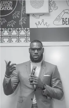  ?? AP Photo/Phil Long ?? ■ LeBron James speaks at a news conference after the opening ceremony for the I Promise School on Monday in Akron, Ohio. The school is supported by the The LeBron James Family Foundation and is run by Akron Public Schools.
