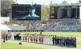  ?? Photo: GETTY IMAGES ?? Guard of honour: Players stand for 63 seconds of applause in memory of Phillip Hughes during day one of the first test between Australia and India at the Adelaide Oval this month.