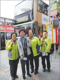  ?? PROVIDED TO CHINA DAILY ?? Chief Executive candidate Carrie Lam Cheng Yuet-ngor poses for a photo with female bus drivers on Wednesday to mark the Internatio­nal Women’s Day.