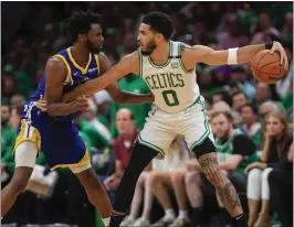  ?? NHAT V. MEYER — STAFF PHOTOGRAPH­ER ?? Jayson Tatum, right, guarded by the Warriors' Andrew Wiggins during the NBA Finals, struggled during the series. Though he averaged 22points, he shot just 37%.