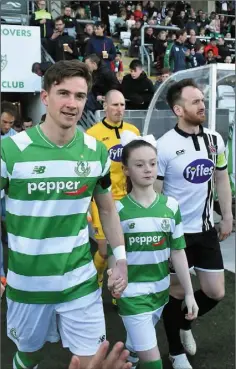  ??  ?? Ronan Finn and Stephen O’Donnell lead their teams out.