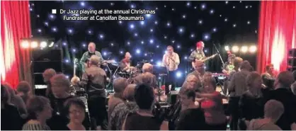  ??  ?? ■■ Dr Jazz playing at the annual Christmas Fundraiser at Canolfan Beaumaris