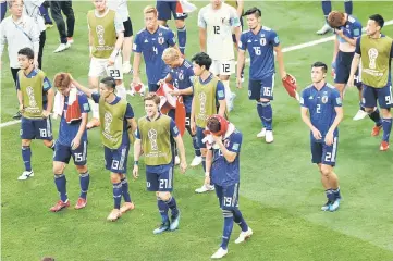  ??  ?? Japan players react after the 2018 World Cup Russia round of 16 match against Belgium in July last year. — Reuters photo