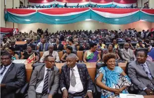  ??  ?? Members of Burundi’s Parliament prepare for the swearing-in ceremony of President Pierre Nkurunziza, in the parliament building in Bujumbura, Burundi. Lawmakers in Burundi overwhelmi­ngly voted in support of a plan to withdraw from the Internatio­nal...