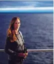  ??  ?? Field biologist Paula von Weller, 45, of Portland, Ore., stands for a portrait aboard the MSV Nordica as it sails toward the Bering Strait.