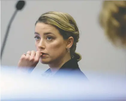  ?? GETTY IMAGES ?? Amber Heard attends her ex-husband Johnny Depp's defamation trial against her in Fairfax, Va. Depp sued Heard for defamation in Fairfax circuit court after she wrote an op-ed piece in The Washington Post in 2018 referring to herself as a “public figure representi­ng domestic abuse.”