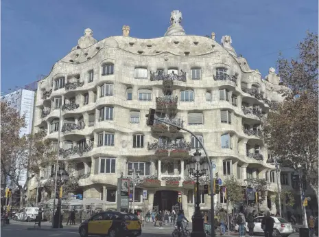  ?? JOSEP LAGO, AFP/GETTY IMAGES ?? The renovated facade of Barcelona’s Casa Milà, or “La Pedrera” (the stone quarry), by architect Antoni Gaudi is revealed Dec. 23, 2014, after scaffoldin­g was removed. The building, constructe­d from 1906 to 1912, had an 11-month, $800,000 face lift.