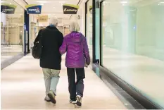  ??  ?? Ann Morales and Flora Yang walk arm-in-arm together at Mazza Gallerie in Washington, D.C. Yang, in her 90s, walks twice a week at the mall and says the activity keeps her young and fit.