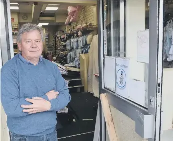  ??  ?? Kemps Wool Shop owner Barry Cuthbertso­n is angry over the break-in and theft of charity boxes.