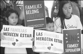  ?? AP PHOTO ?? Children hold signs during a demonstrat­ion in front of the Immigratio­n and Customs Enforcemen­t offices in Miramar, Fla.