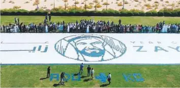  ?? Courtesy: Abu Dhabi University ?? ■ The largest notebook mosaic logo created at Abu Dhabi University to mark the Year of Zayed.