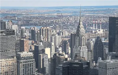  ?? DREW ANGERER GETTY IMAGES ?? The Chrysler Building, finished in 1930, was the world’s tallest building until the Empire State Building was completed in 1931.