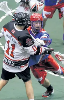  ?? CLIFFORD SKARSTEDT/EXAMINER FILES ?? Peterborou­gh Century 21 Lakers' Jake Withers checks Brooklin Redmen's Austin Shanks during first period MSL action on Thursday at the Memorial Centre.