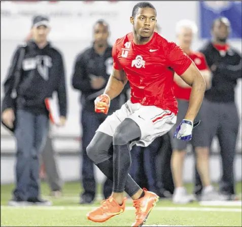  ?? PAUL VERNON / ASSOCIATED PRESS ?? Ohio State linebacker Darron Lee, whom Falcons coach Dan Quinn traveled to Columbus, Ohio, to see work out, has intrigued Atlanta scouts with his speed and his football instincts.