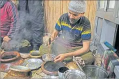  ??  ?? ■ In winter, the thick meat stew called harisa is the only item on the Dilshad restaurant menu. A small plate (right) costs Rs 50 and they dish up hundreds every morning.