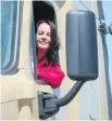  ??  ?? Truck driver Nadine Gauthier at the wheel of a Freightlin­er.