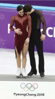  ?? STEVE RUSSELL/TORONTO STAR ?? Canadian ice dance sensations Tessa Virtue and Scott Moir closed out their Olympic careers bathed in gold. Maybe they should march out with the flag they brought in.