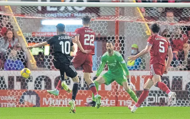  ??  ?? ABERDEEN AGONY: Qarabag’s Abdellah Zoubir scores to make it 3-0 against the Dons in last night’s Europa Conference League qualifier at Pittodrie.