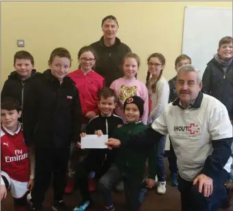  ??  ?? Pictured are children from the Maugherow area presenting a cheque to Michael Carr (SHOUT), the proceeds of the St Stephen’s Day charity swim at Raughley organised annually by Jimmy Currid. A cheque was also presented to MS Therapy Centre.