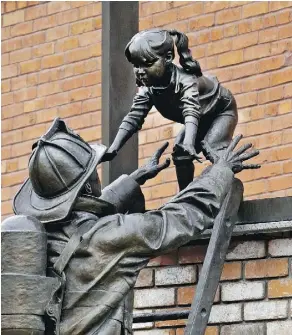  ?? LARRY WONG ?? The Rescue, in the Edmonton Firefighte­rs Memorial Plaza, was created by Edmonton-based artist Danek Mozdzenski.