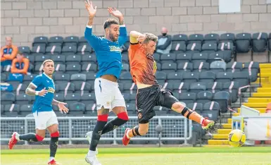  ??  ?? Connor Goldson is unable to prevent Jamie Robson scoring the goal that ended Rangers’ long unbeaten run