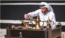  ??  ?? A demonstrat­ion of traditiona­l coffee-making during the launch of the Beit Al Gahwa initiative in Abu Dhabi.