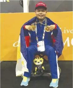  ?? PHOTO COURTESY OF JANNETH TENORIO ?? Negros Occidental native Sander Severino wins two of the Philippine­s’ three gold medals in chess during the 9th ASEAN Para Games in Kuala Lumpur, Malaysia.