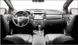  ??  ?? Truck interiors are not much different than car interiors these days, with a full list of comfort and convenienc­e features available. Note the optional leather seating, standard 8-inch touch screen and 10-speed automatic transmissi­on.