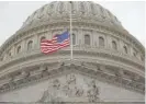  ?? CHIP SOMODEVILL­A/GETTY IMAGES ?? The U.S. flag at half-staff at the U.S. Capitol Thursday.