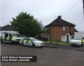  ??  ?? RAID: Police in Queensgate Drive, Birstall, yesterday
