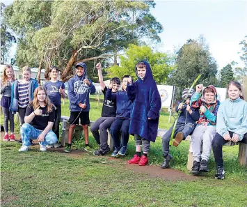  ?? ?? Archery is a favourite activity for many (from left): Nevaeh Thetford, Macie Thomas, Charlize Coffey (kneeling down), Aidan Cathomen, Ricoh Harris-Leota, Phoenix Grzesinski, Ray Wang, Riley Jose, Drew Turner, Braxton Byrnes and Sapphire Lee.