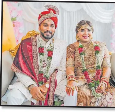  ?? ?? The couple in their stunning wedding outfits on their special day.