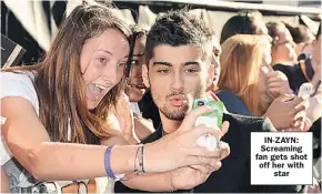  ??  ?? IN-ZAYN: Screaming fan gets shot off her with
star